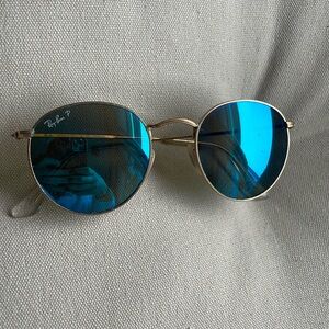Round Ray-Ban sunglasses, gold metal, blue mirrored lenses